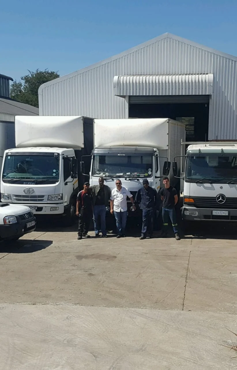 Rivers Of Africa team with delivery trucks